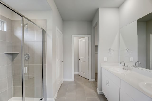 610 Willet Dr, Mckinney, TX 75069 - full bathroom with double vanity, a sink, baseboards, tile patterned flooring, and a shower stall