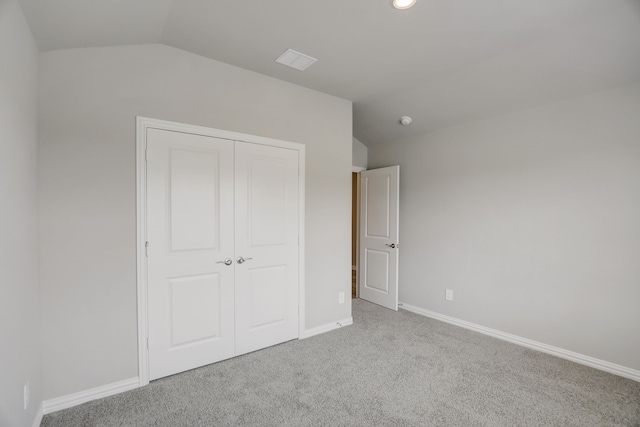 610 Willet Dr, Mckinney, TX 75069 - unfurnished bedroom featuring a closet, baseboards, visible vents, vaulted ceiling, and carpet floors