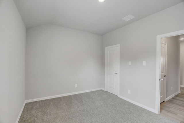 610 Willet Dr, Mckinney, TX 75069 - spare room featuring light carpet, baseboards, and lofted ceiling