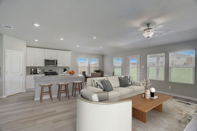 610 Willet Dr, Mckinney, TX 75069 - living room featuring ceiling fan, recessed lighting, visible vents, and light wood-style floors