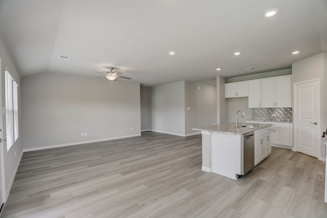 610 Willet Dr, Mckinney, TX 75069 - kitchen with a ceiling fan, stainless steel dishwasher, a sink, light wood-style floors, and tasteful backsplash