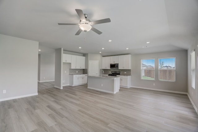 610 Willet Dr, Mckinney, TX 75069 - unfurnished living room featuring ceiling fan, recessed lighting, baseboards, and light wood-style floors