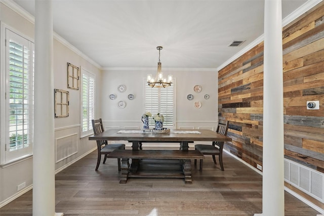 1102 Belvedere Dr, Allen, TX 75013 - dining area featuring a chandelier, wood finished floors, visible vents, and crown molding