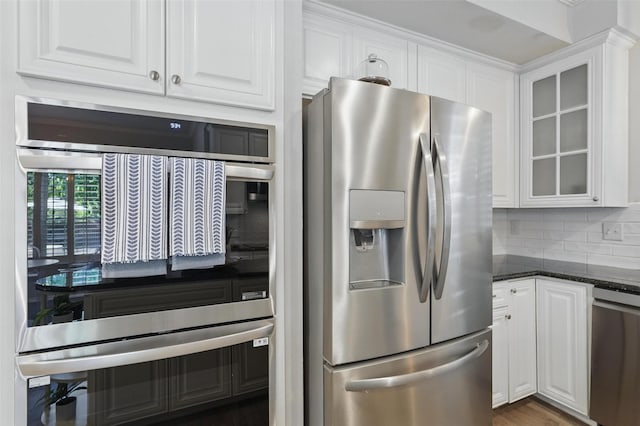 1102 Belvedere Dr, Allen, TX 75013 - kitchen with backsplash, white cabinetry, stainless steel appliances, and glass insert cabinets