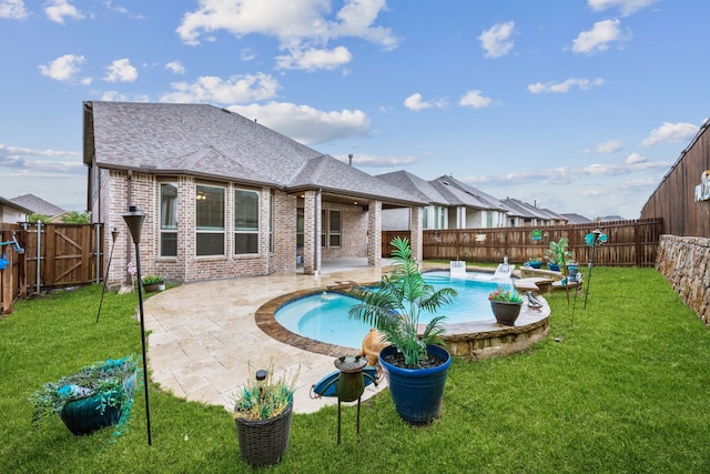 view of pool featuring a lawn, a fenced in pool, a fenced backyard, and a patio area