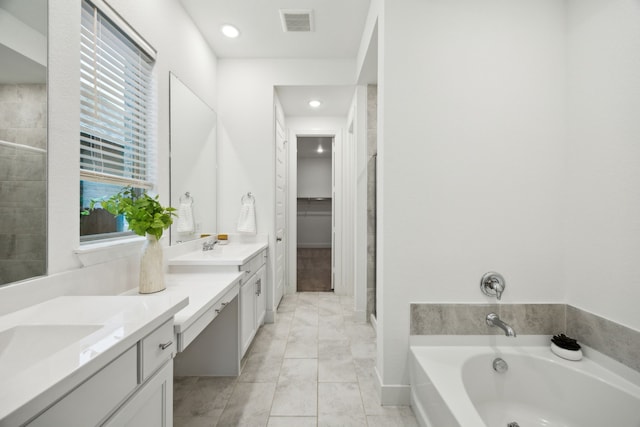 full bath with visible vents, double vanity, a garden tub, a shower, and recessed lighting