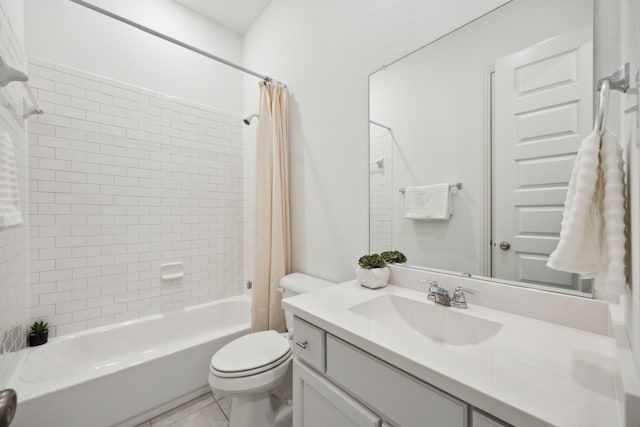 full bathroom featuring vanity, tile patterned floors, toilet, and shower / tub combo
