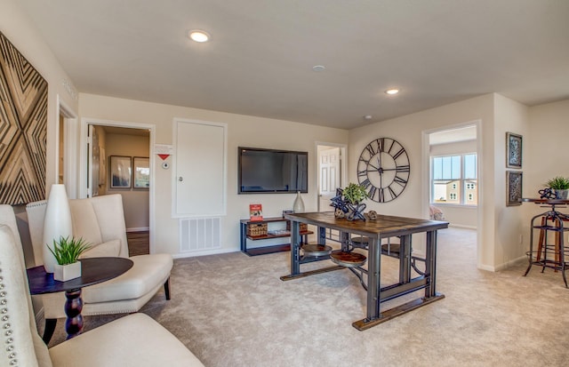 interior space featuring recessed lighting, visible vents, baseboards, and light carpet