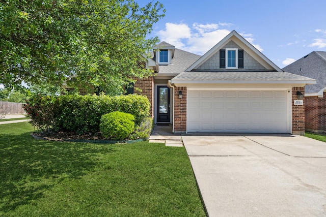 view of front of house featuring brick siding, roof with shingles, driveway, and a front yard