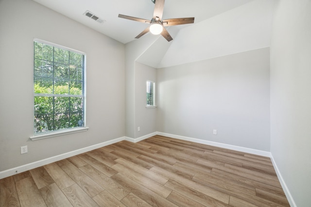 empty room with plenty of natural light, light wood-style flooring, and visible vents