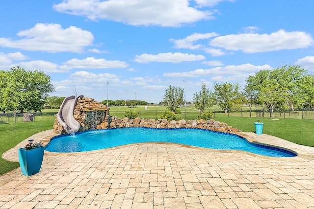 view of pool featuring a water slide and a patio