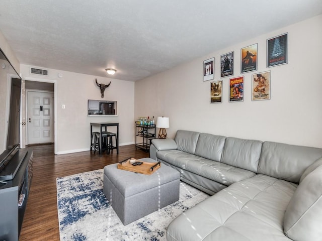 4539 N O Connor Rd Unit 2234, Irving, TX 75062 - living room featuring dark wood-style floors and baseboards