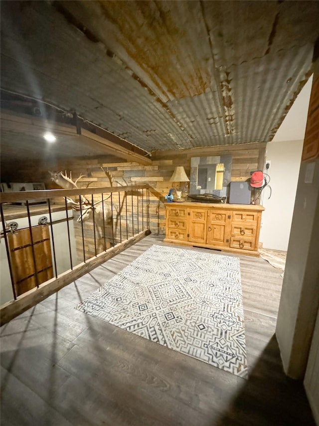 additional living space featuring wood finished floors
