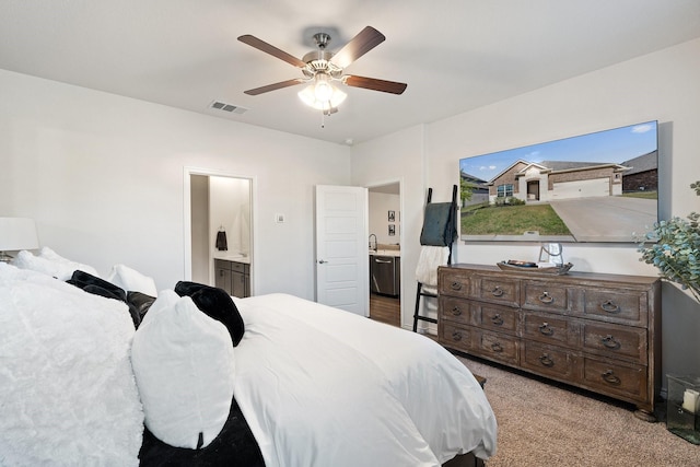 carpeted bedroom featuring connected bathroom, a ceiling fan, and visible vents