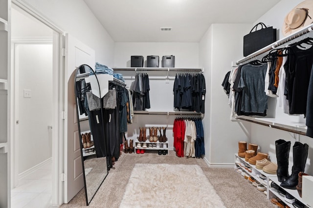 spacious closet featuring visible vents and carpet