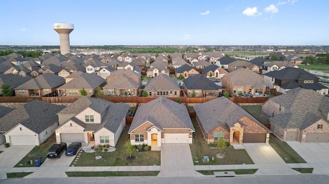 birds eye view of property with a residential view