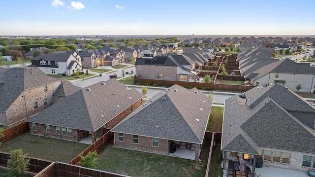 birds eye view of property with a residential view