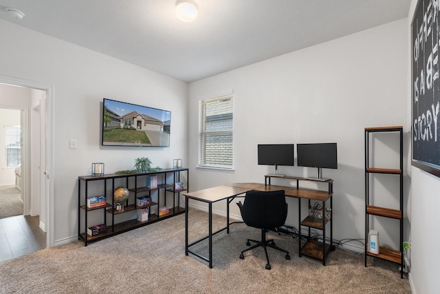 office area featuring carpet floors and baseboards