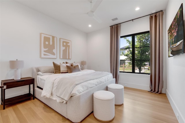 bedroom featuring recessed lighting, light wood-style flooring, and baseboards