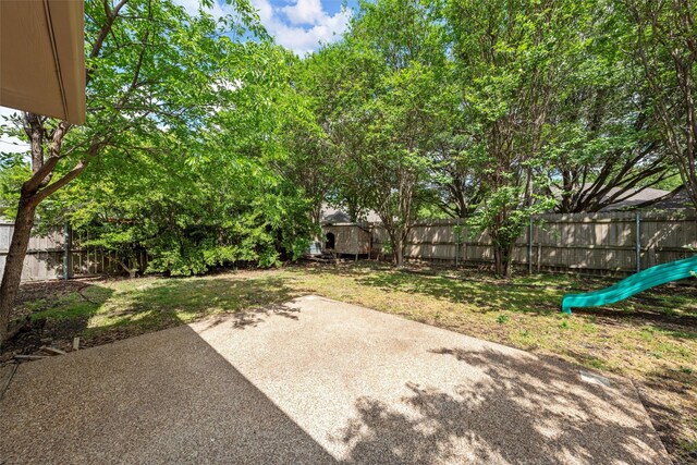 view of yard with a fenced backyard and a patio area