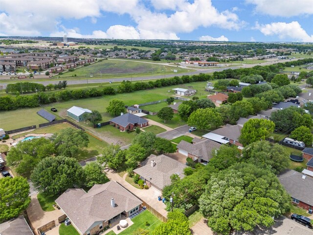 birds eye view of property with a residential view