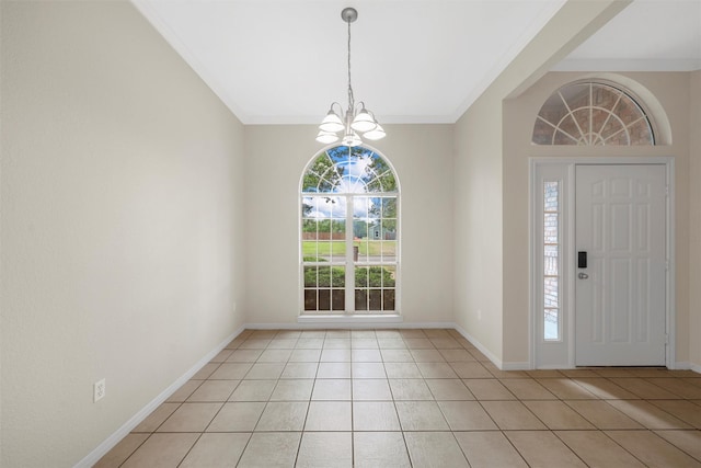 foyer with baseboards, an inviting chandelier, ornamental molding, and light tile patterned floors