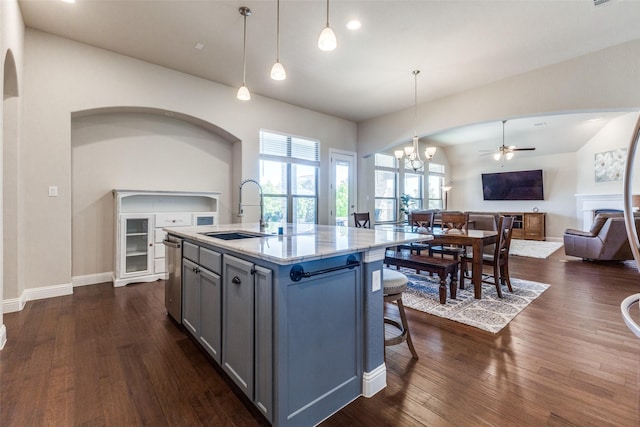 560 Southwestern Dr, Rockwall, TX 75087 - kitchen with a sink, open floor plan, dishwasher, a chandelier, and gray cabinets