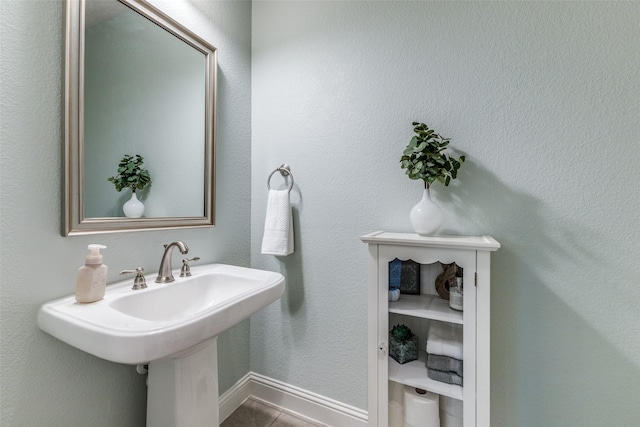 560 Southwestern Dr, Rockwall, TX 75087 - bathroom featuring tile patterned floors and baseboards