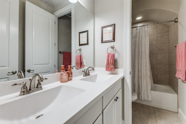 560 Southwestern Dr, Rockwall, TX 75087 - bathroom with tile patterned floors, toilet, shower / tub combo with curtain, and double vanity