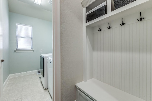 560 Southwestern Dr, Rockwall, TX 75087 - mudroom with washing machine and dryer, light tile patterned floors, and baseboards