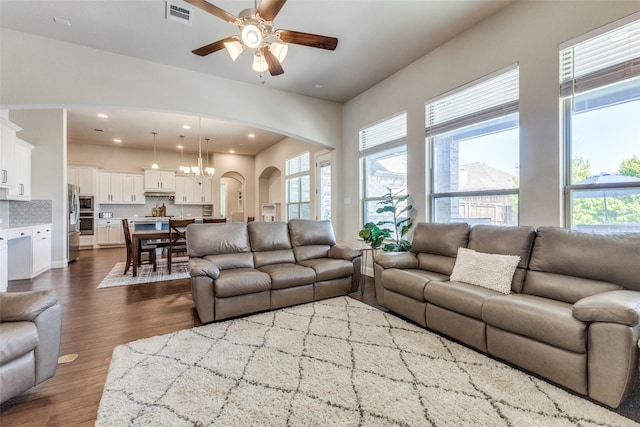560 Southwestern Dr, Rockwall, TX 75087 - living area featuring arched walkways, ceiling fan, dark wood finished floors, and recessed lighting