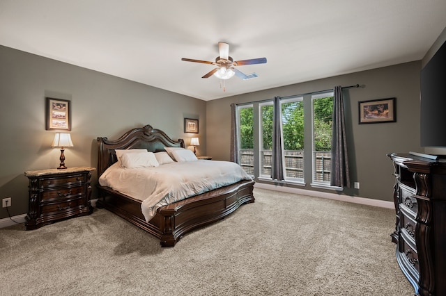 bedroom featuring ceiling fan, baseboards, carpet flooring, and visible vents