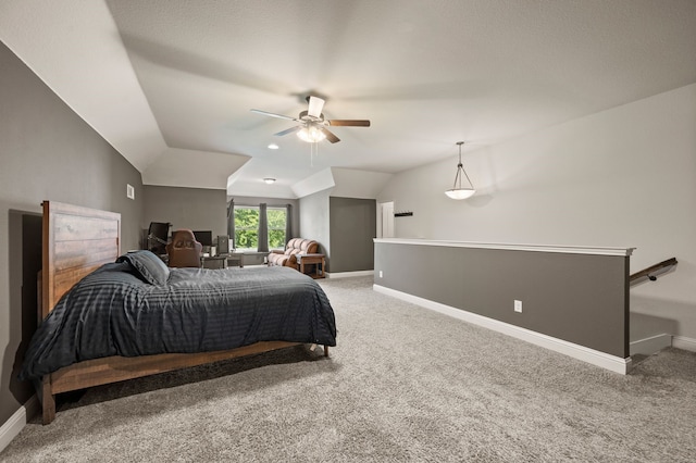 bedroom featuring lofted ceiling, a ceiling fan, baseboards, and carpet