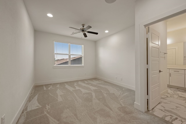 empty room featuring light carpet, a ceiling fan, baseboards, and recessed lighting