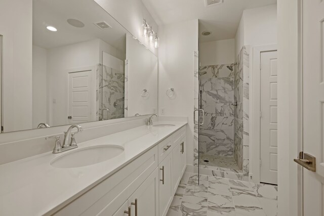 full bathroom with marble finish floor, a sink, visible vents, and a stall shower