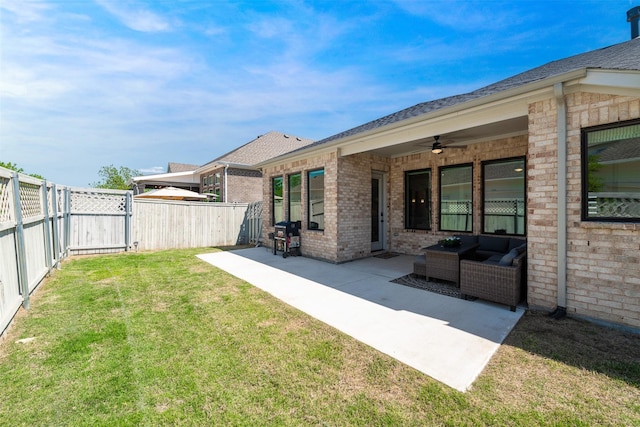 view of yard featuring a patio, ceiling fan, and a fenced backyard