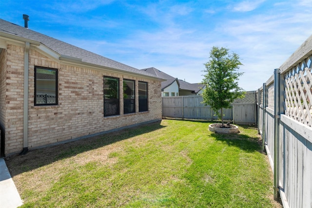 view of yard featuring a fenced backyard