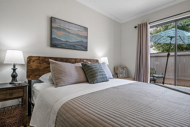 bedroom featuring access to outside and ornamental molding