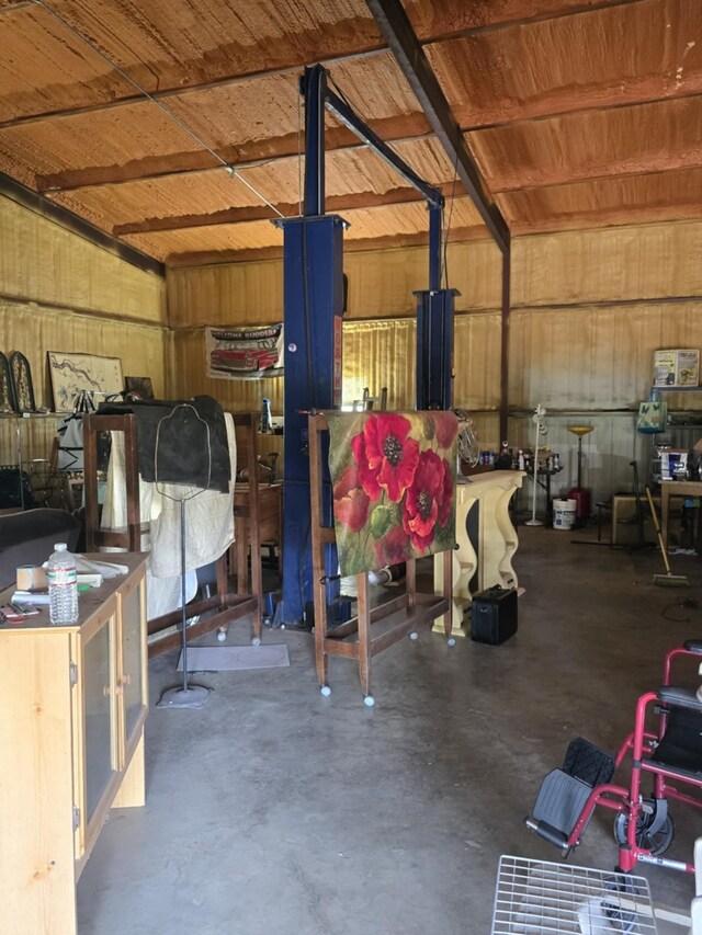 garage featuring wooden walls