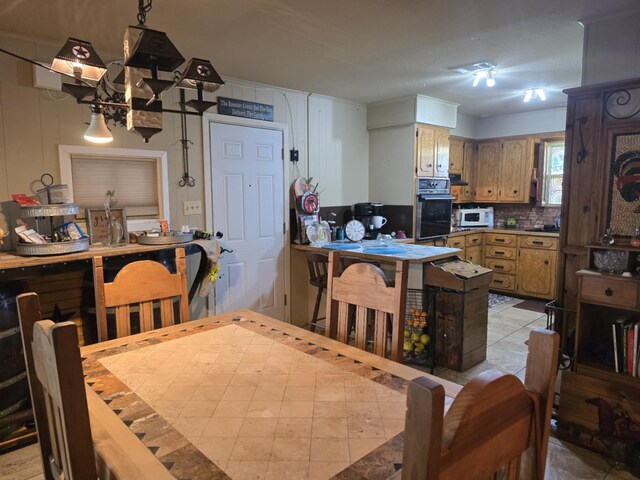 dining space featuring light tile patterned floors