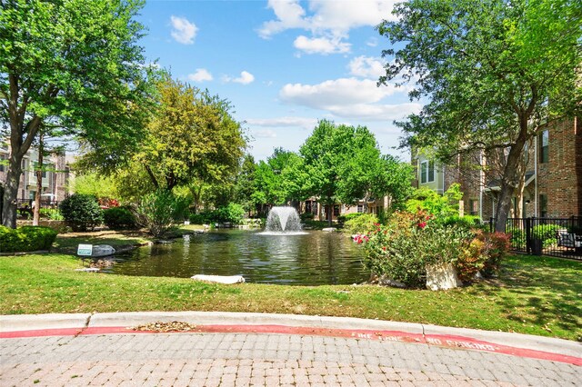 surrounding community with a water view