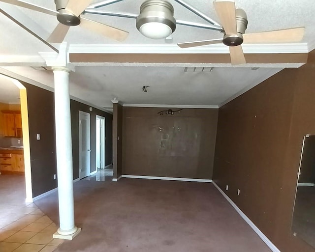 interior space with visible vents, crown molding, baseboards, decorative columns, and ceiling fan