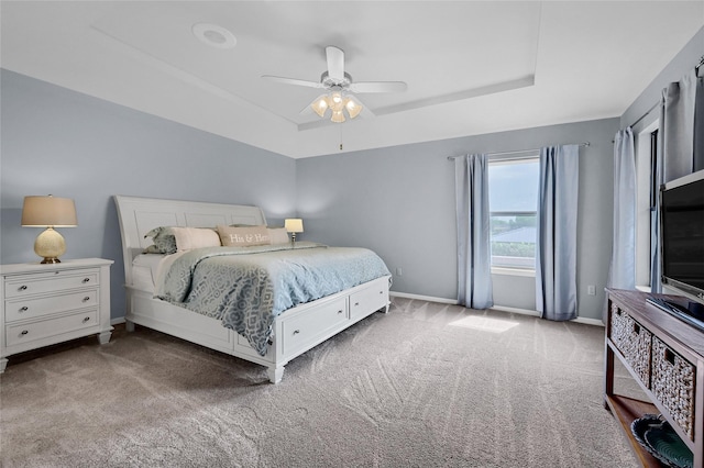 511 Kiowa Dr W, Lake Kiowa, TX 76240 - carpeted bedroom with baseboards, a ceiling fan, and a tray ceiling