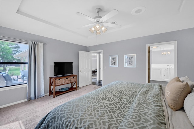 511 Kiowa Dr W, Lake Kiowa, TX 76240 - bedroom featuring ensuite bathroom, ceiling fan, a raised ceiling, baseboards, and carpet flooring