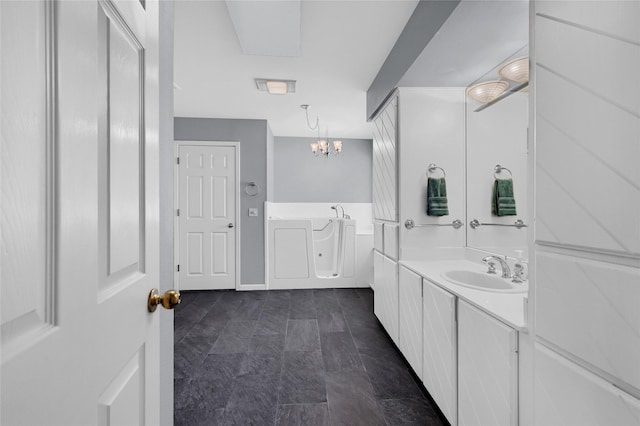 511 Kiowa Dr W, Lake Kiowa, TX 76240 - bathroom featuring vanity and an inviting chandelier