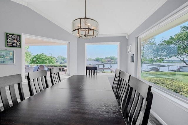 511 Kiowa Dr W, Lake Kiowa, TX 76240 - dining space with ornamental molding, lofted ceiling, and a notable chandelier