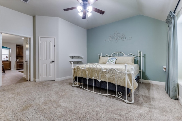 bedroom featuring carpet floors, a ceiling fan, baseboards, and lofted ceiling