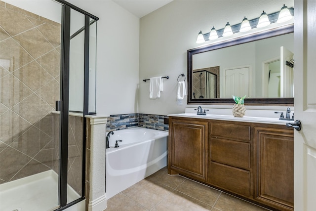full bathroom with a bath, double vanity, tile patterned flooring, and a stall shower