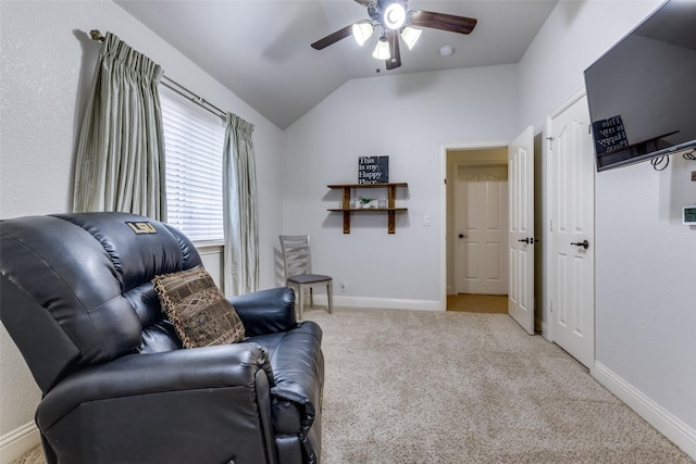 sitting room featuring carpet floors, a ceiling fan, baseboards, and vaulted ceiling