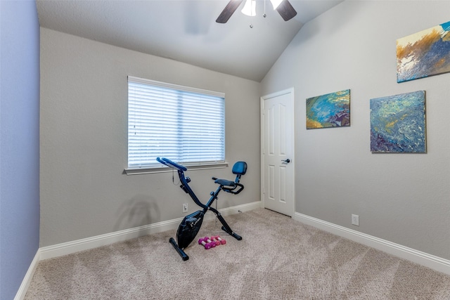 workout room with baseboards, ceiling fan, carpet, and vaulted ceiling